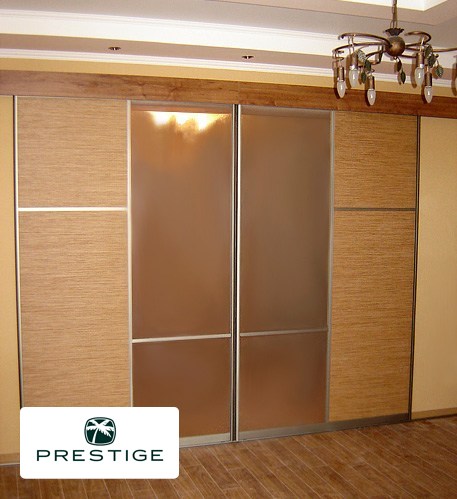 Sliding door wardrobesRoom divider is created from materials of warm sandy colors