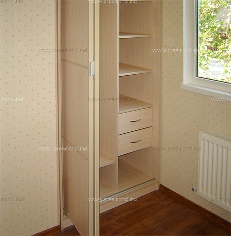 Sliding door wardrobesSmall built-in wardrobe is hiding in the corner