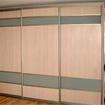 Sliding door wardrobe: light panels are built up in the golden frame
