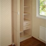 Small built-in wardrobe is hiding in the corner